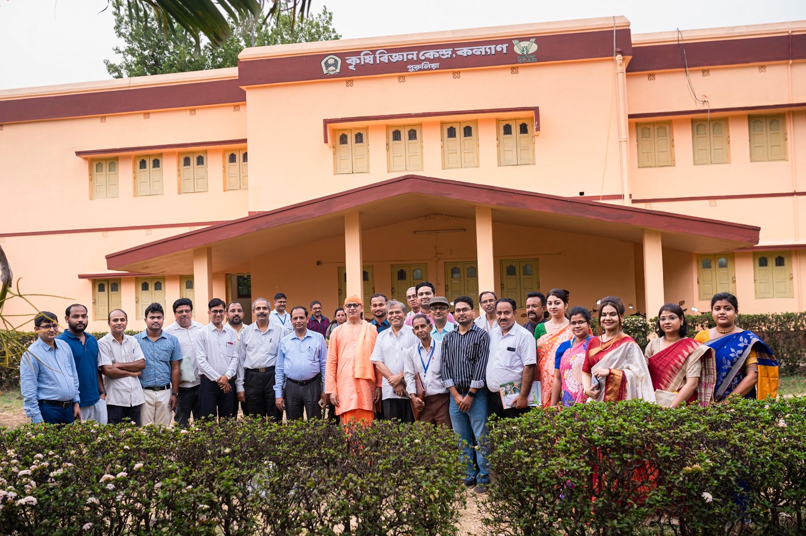 All staffs of KVK are standing in front of the kvk office ,